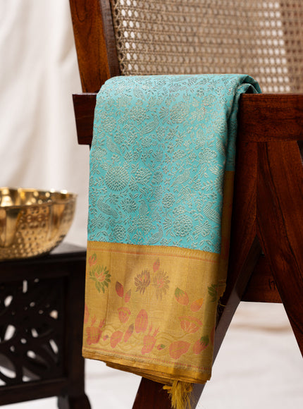 Light Blue Kanchipuram Silk Saree With Silver Brocade In Contrast Yellow Border