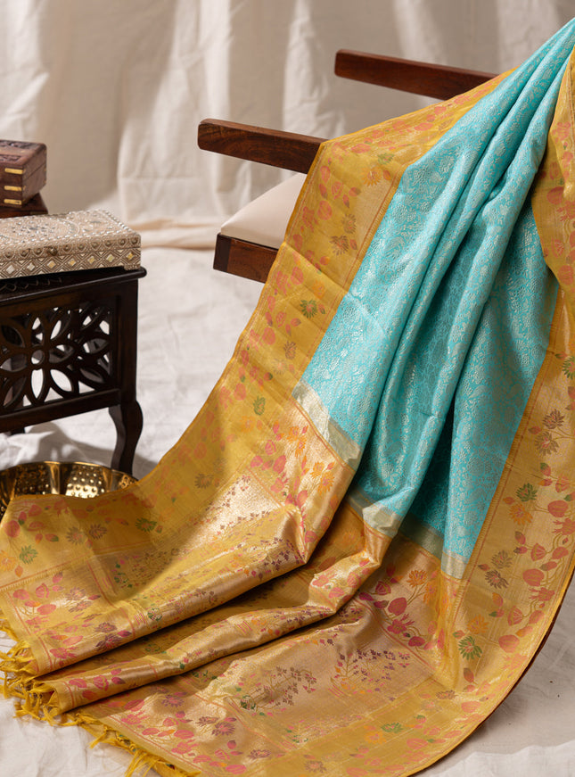 Light Blue Kanchipuram Silk Saree With Silver Brocade In Contrast Yellow Border