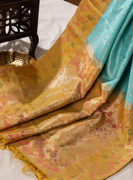 Light Blue Kanchipuram Silk Saree With Silver Brocade In Contrast Yellow Border