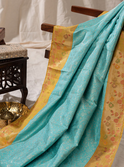 Light Blue Kanchipuram Silk Saree With Silver Brocade In Contrast Yellow Border