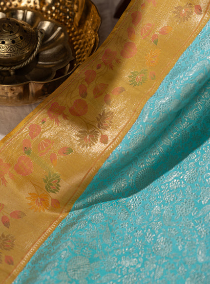 Light Blue Kanchipuram Silk Saree With Silver Brocade In Contrast Yellow Border