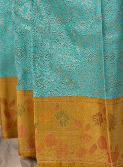 Light Blue Kanchipuram Silk Saree With Silver Brocade In Contrast Yellow Border