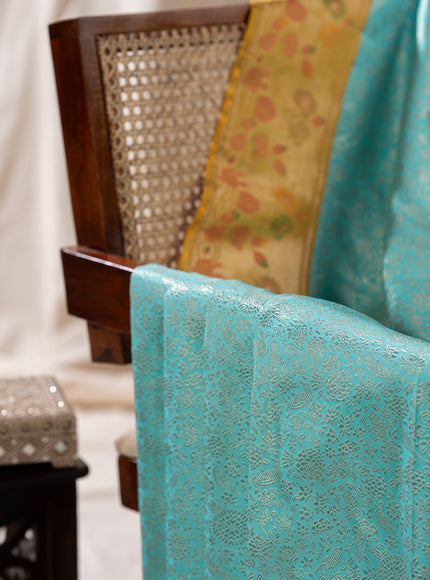Light Blue Kanchipuram Silk Saree With Silver Brocade In Contrast Yellow Border