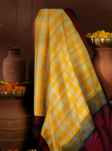 Yellow Kanchipuram Silk Saree With Different Colored Checks In The Body