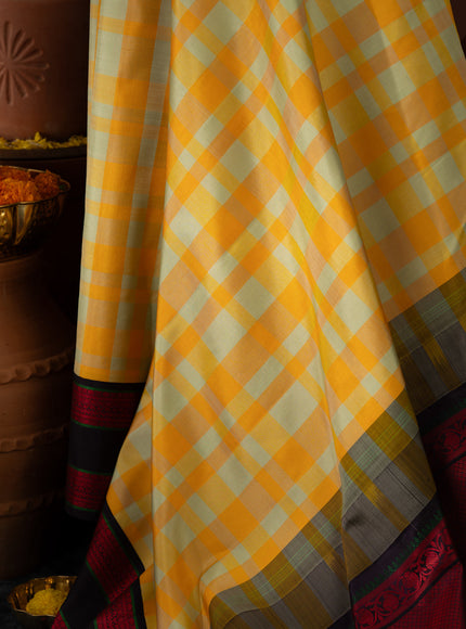 Yellow Kanchipuram Silk Saree With Different Colored Checks In The Body