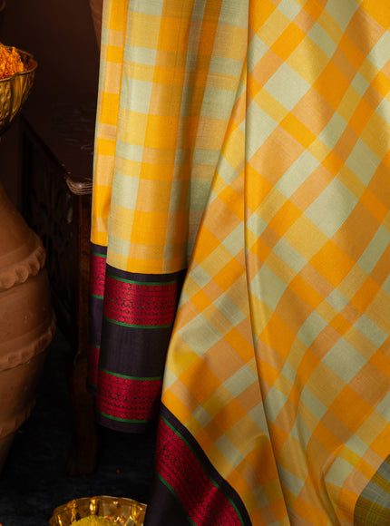 Yellow Kanchipuram Silk Saree With Different Colored Checks In The Body