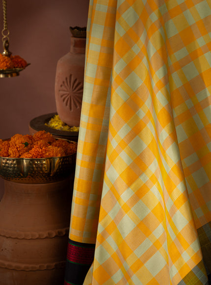 Yellow Kanchipuram Silk Saree With Different Colored Checks In The Body