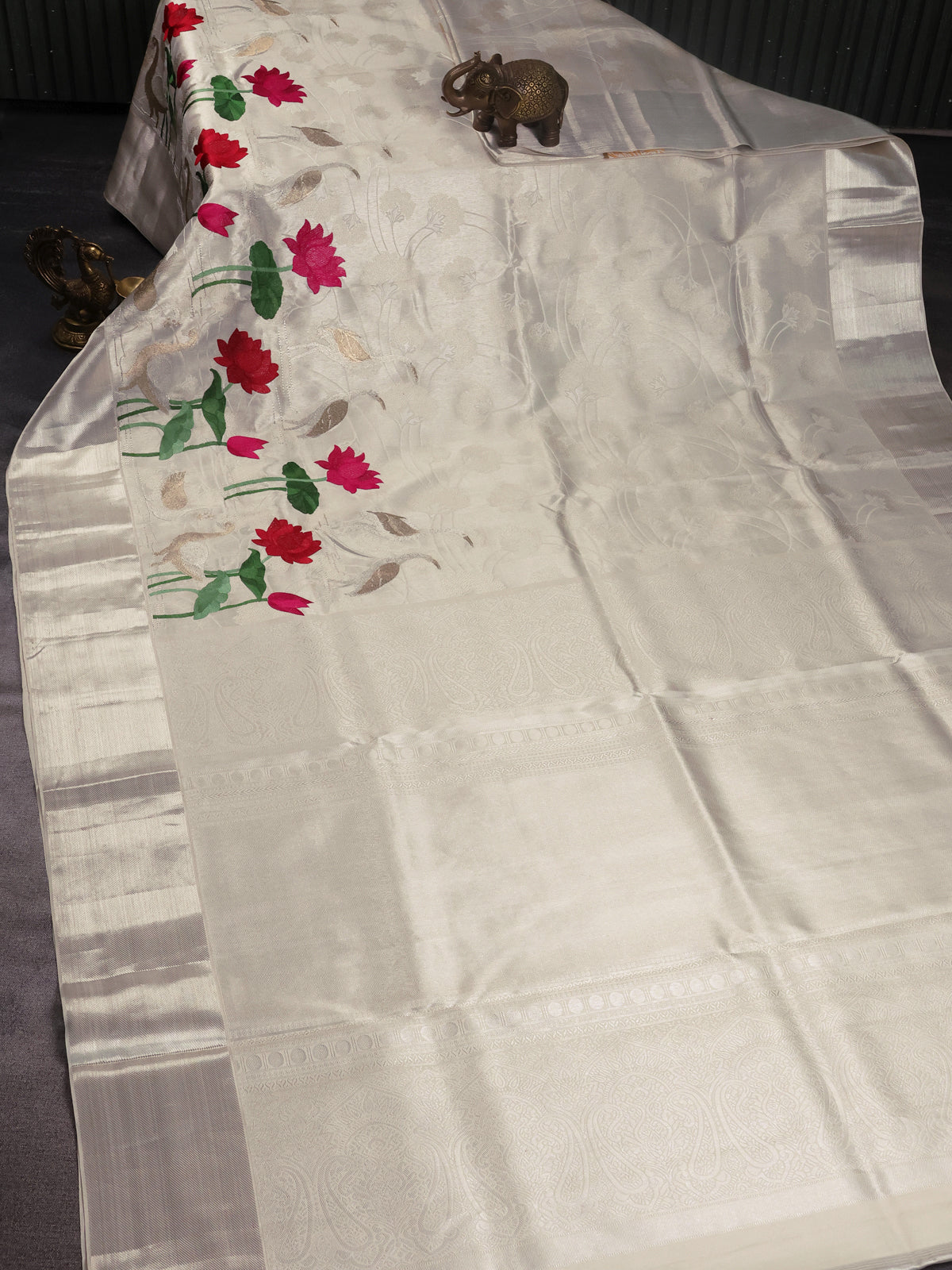 Tissue Kanchipuram Silk Saree With Allover Embroidery And Silver Zari