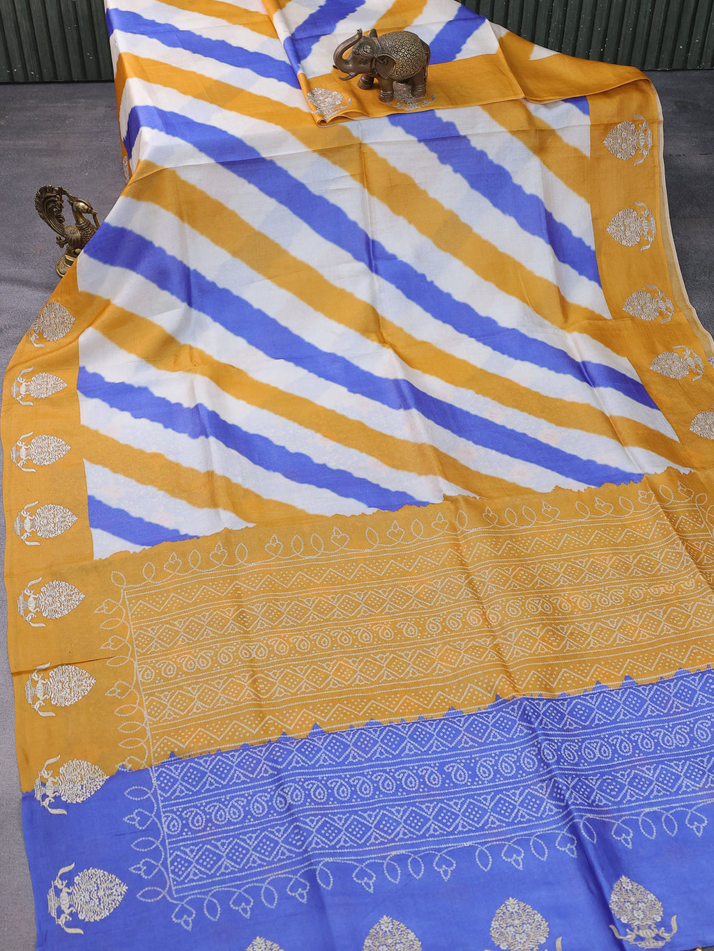 Beige Blue Yellow Tussar Silk Saree With Leheriya Design And Embroided Butta Border