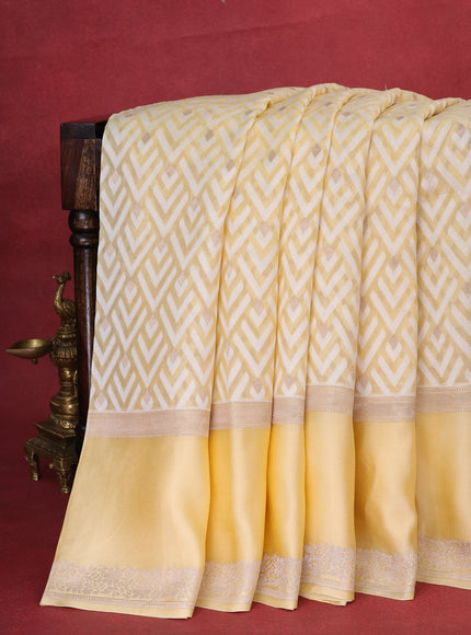 Pale Yellow Banarasi Kora Saree With Allover Thread Weaves And Satin Border