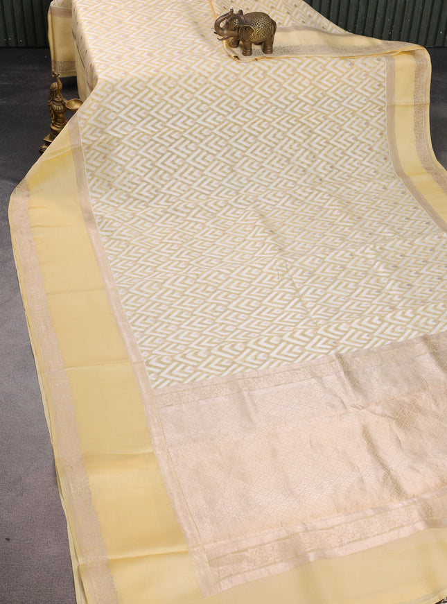 Pale Yellow Banarasi Kora Saree With Allover Thread Weaves And Satin Border