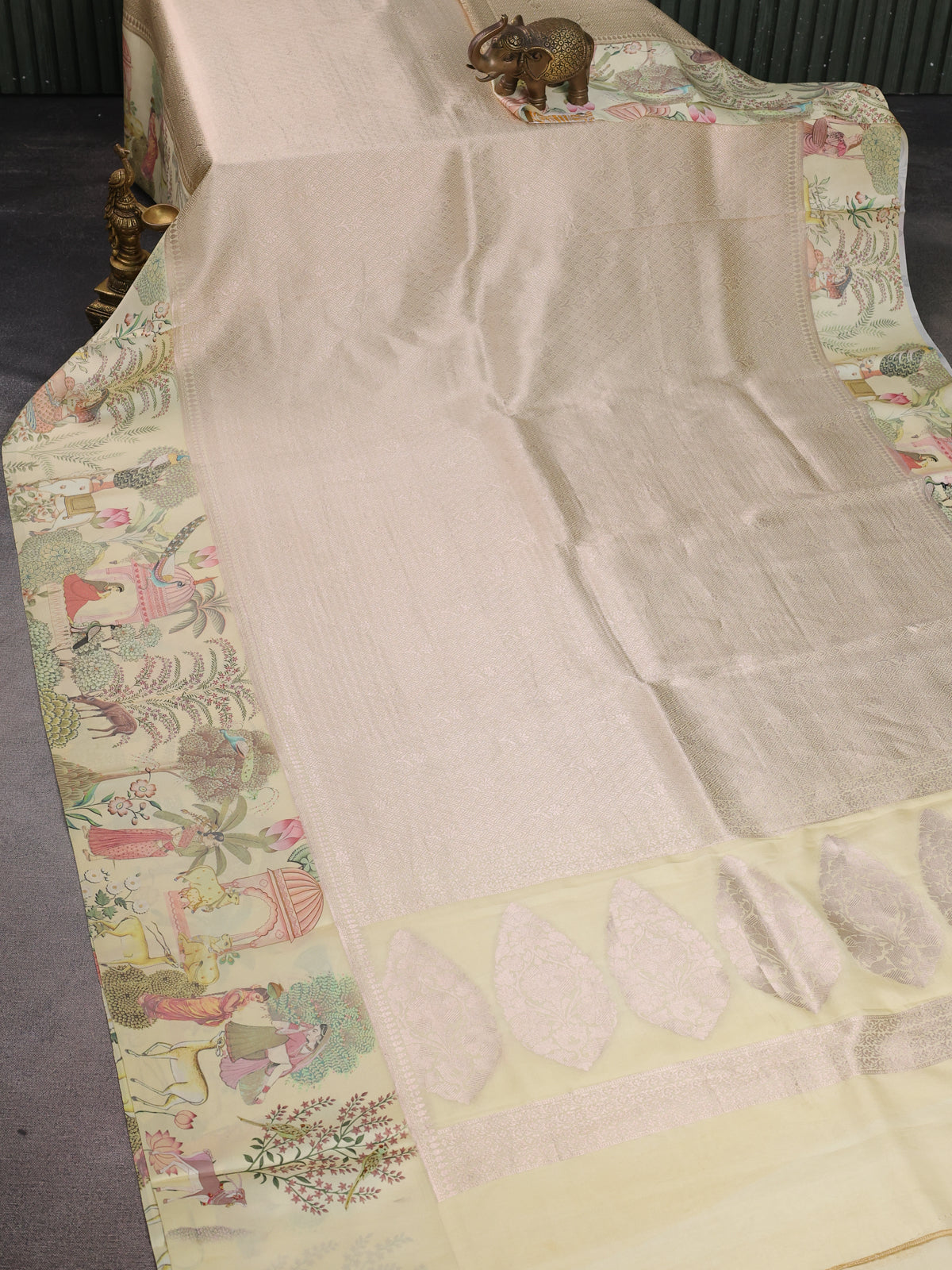 Cream Banarasi Silk Saree With Allover Zari Weaves & Satin Border Prints