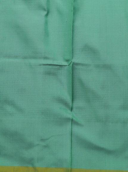 Teal Green Ikkat Silk Saree