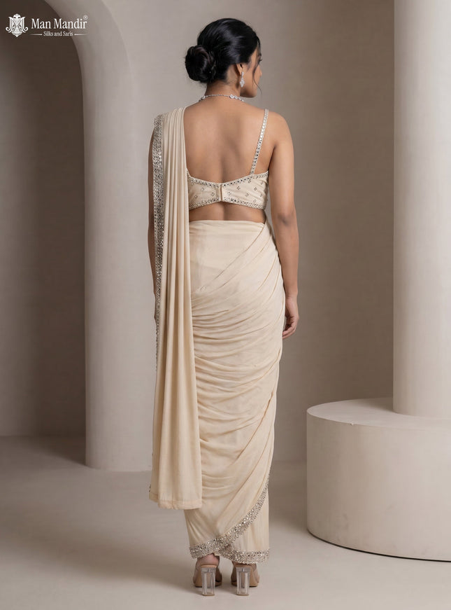 Beige Georgette Pre Draped Saree With Mirror Embroidered Blouse