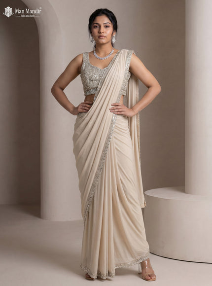 Beige Georgette Pre Draped Saree With Mirror Embroidered Blouse