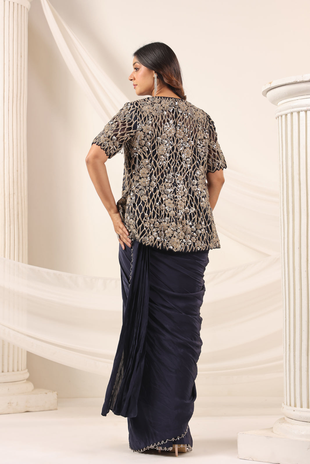 Navy Blue Crepe Pre-Draped Saree With Croptop And Heavy Sequined Net Jacket
