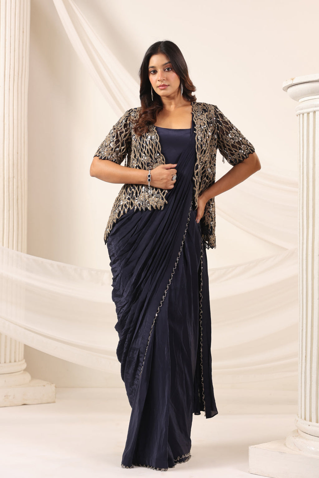 Navy Blue Crepe Pre-Draped Saree With Croptop And Heavy Sequined Net Jacket