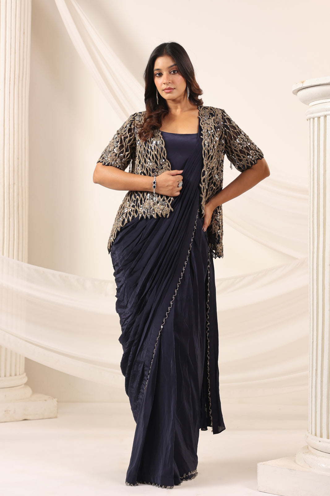 Navy Blue Crepe Pre-Draped Saree With Croptop And Heavy Sequined Net Jacket