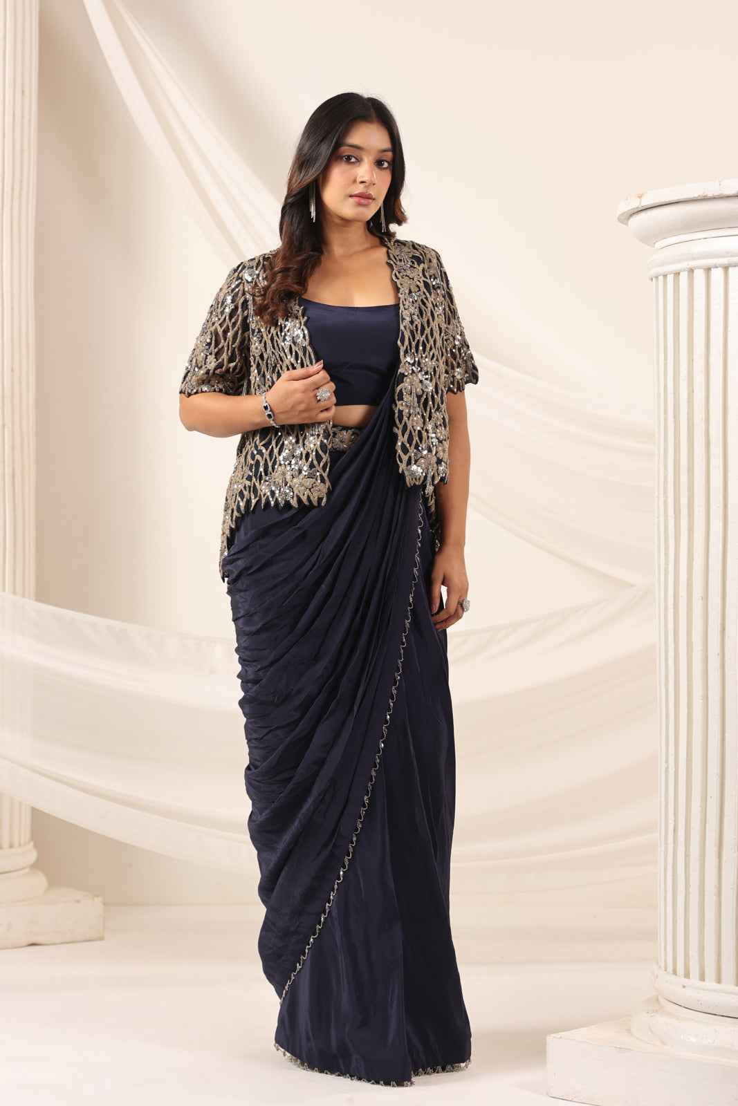 Navy Blue Crepe Pre-Draped Saree With Croptop And Heavy Sequined Net Jacket