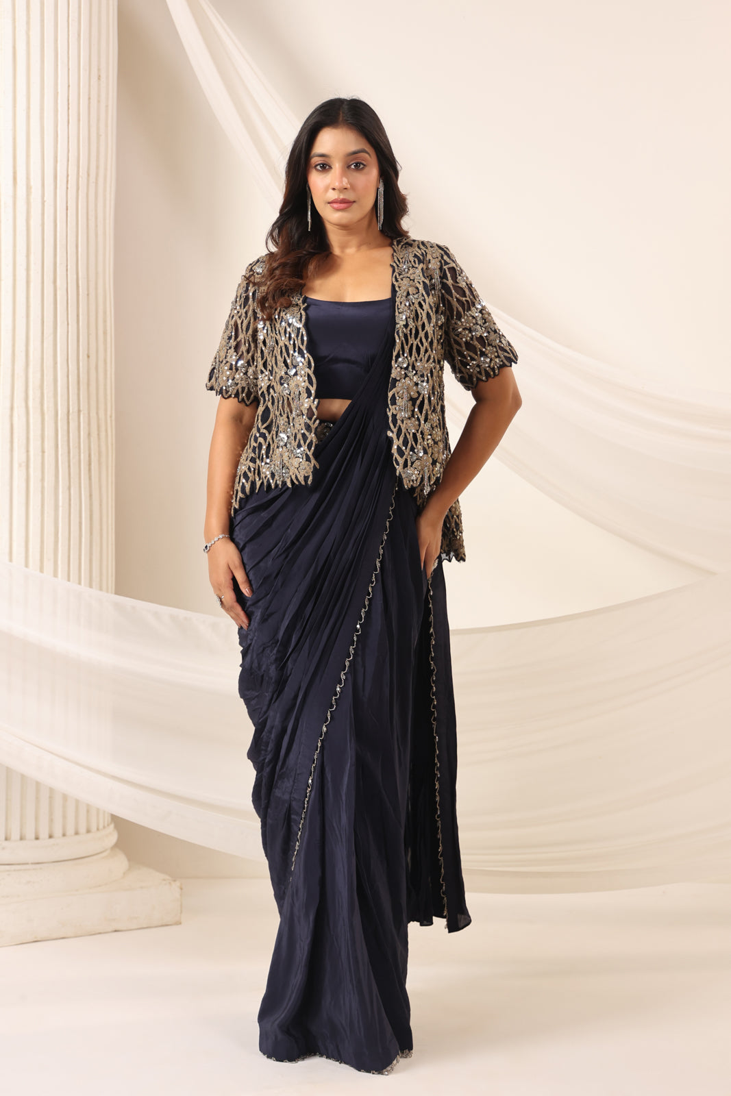 Navy Blue Crepe Pre-Draped Saree With Croptop And Heavy Sequined Net Jacket