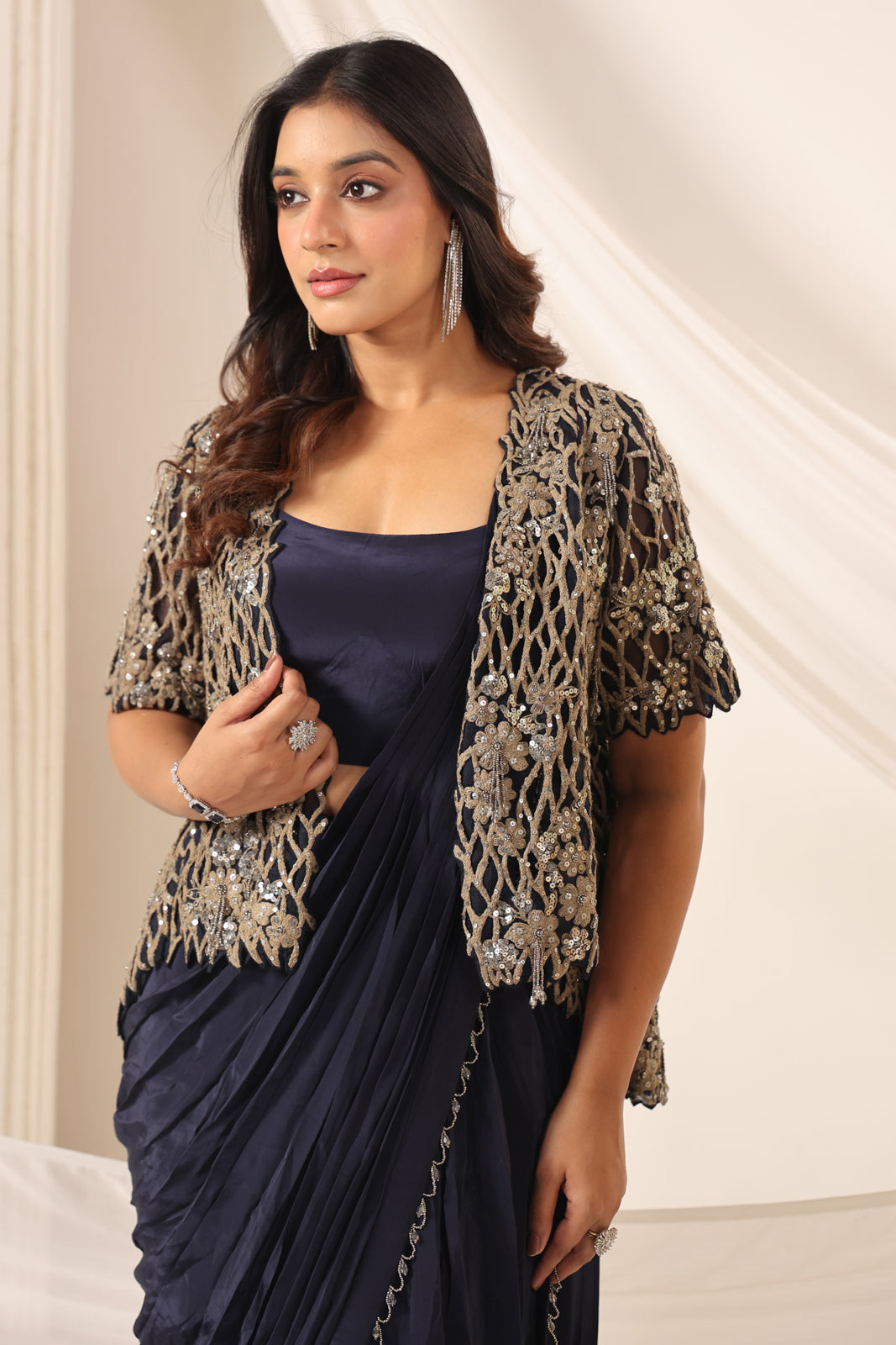 Navy Blue Crepe Pre-Draped Saree With Croptop And Heavy Sequined Net Jacket