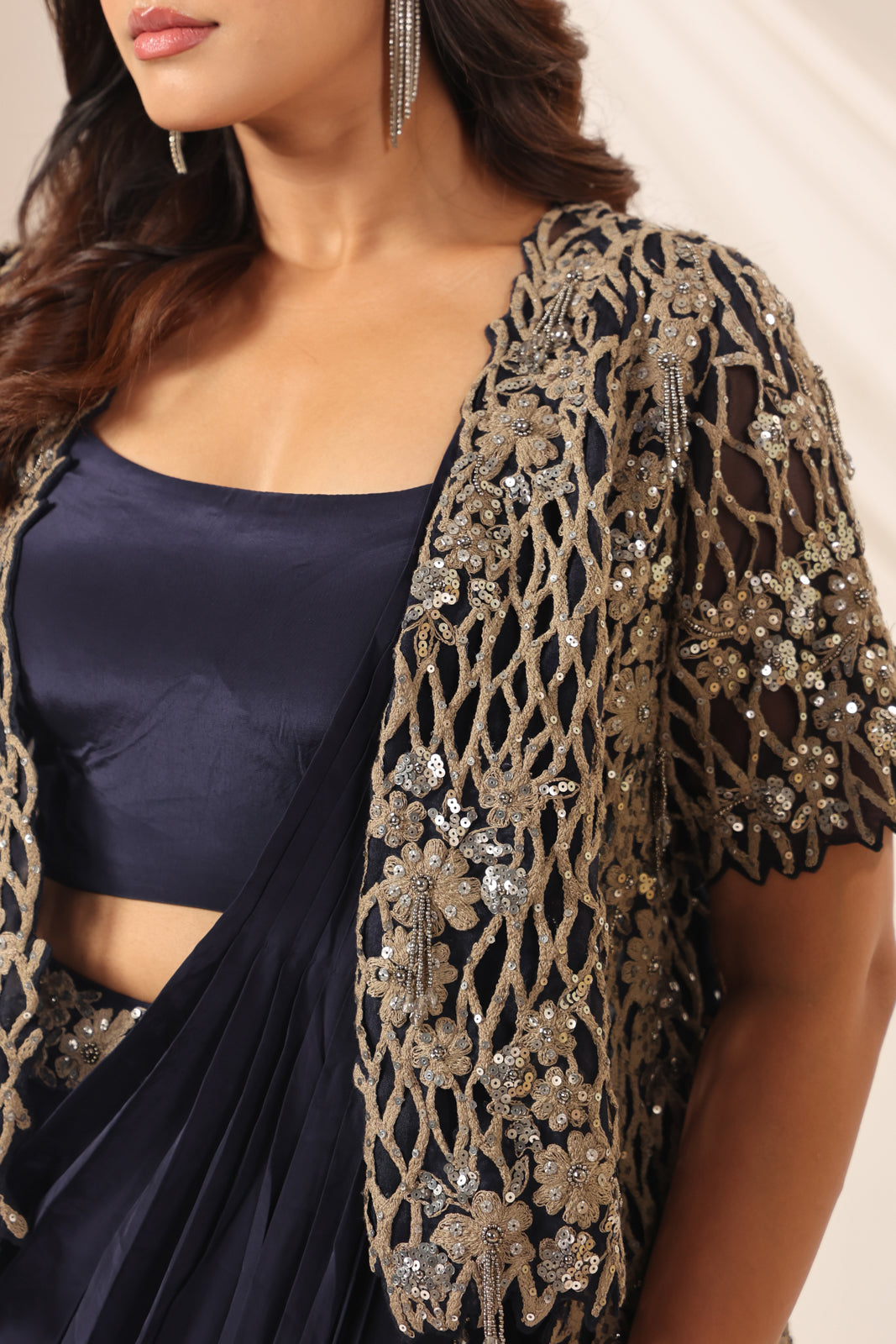 Navy Blue Crepe Pre-Draped Saree With Croptop And Heavy Sequined Net Jacket