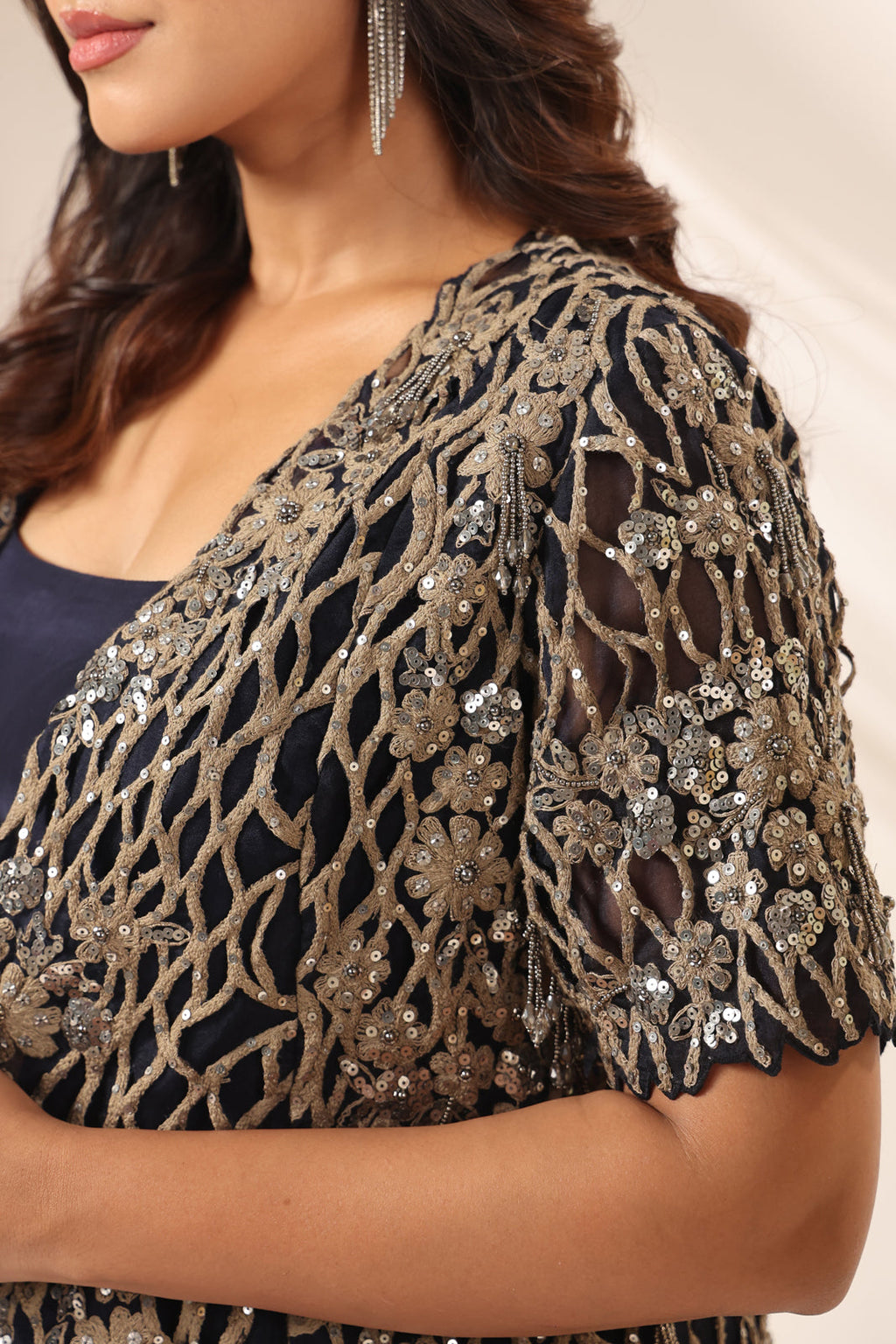 Navy Blue Crepe Pre-Draped Saree With Croptop And Heavy Sequined Net Jacket