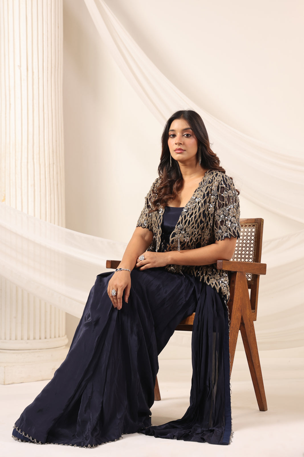 Navy Blue Crepe Pre-Draped Saree With Croptop And Heavy Sequined Net Jacket